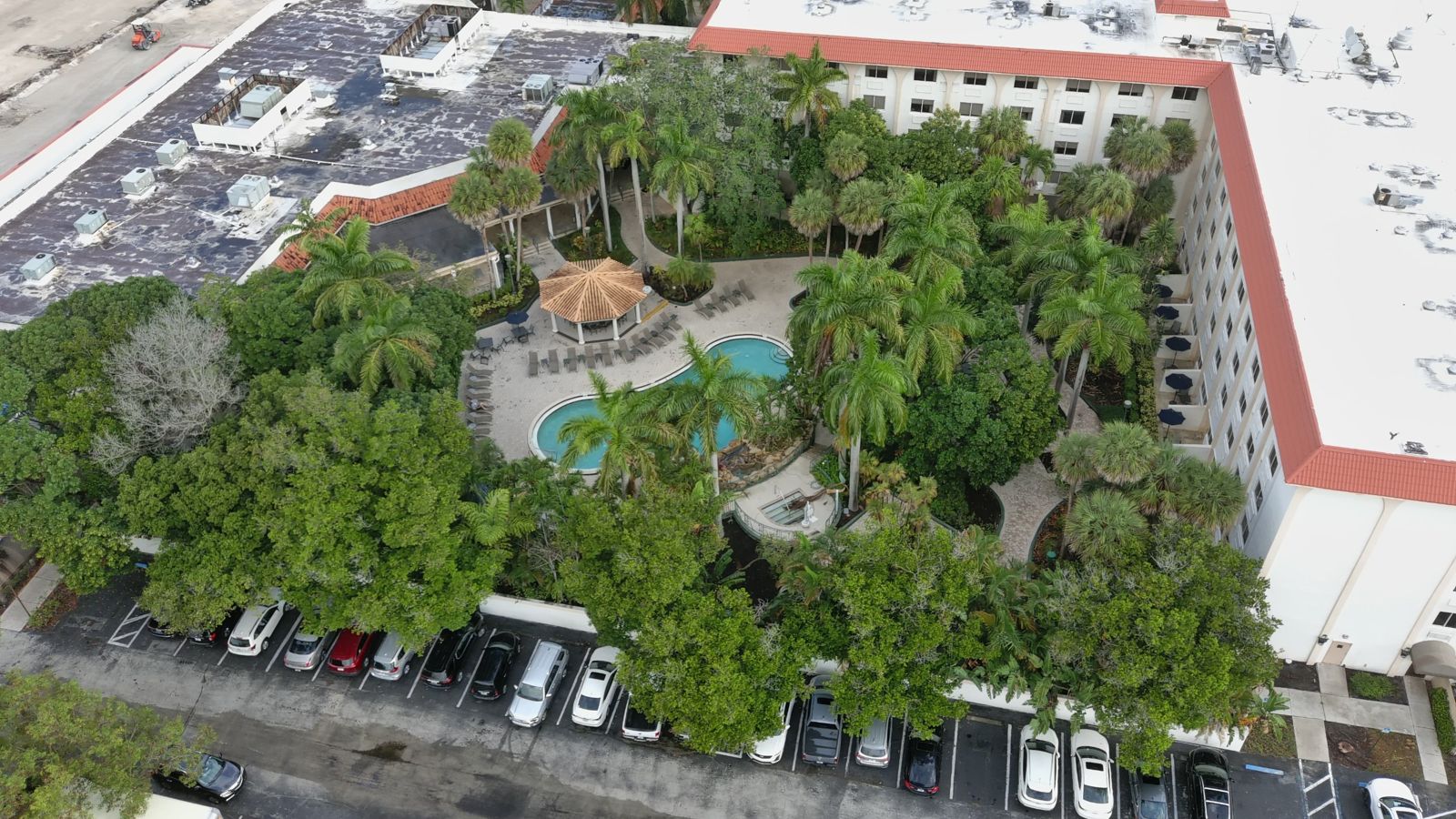 Hotel pool courtyard before renovation, aerial view